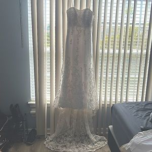 Never worn Alfred Angelo wedding gown beaded with semi train.  Beautiful